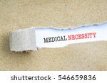 The text MEDICAL NECESSITY behind torn brown paper