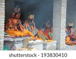 Small photo of LIJIANG, CHINA - SEPTEMBER 19: Unidentified lamas recite sutras to expiate the soul of the dead during a cremation ceremony of Mosuo Minority People, September 19, 2013, Yongning, Lijiang, China