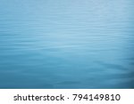 blue sea with waves and calm ocean water surface with small ripples