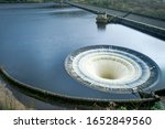 Ladybower Reservoir is the lowest of three reservoirs in the Upper Derwent . Bellmouth overflows (locally named the 