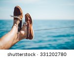 Photo of man legs on the yacht and wearing boat shoes
