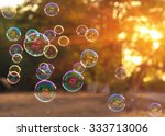 soap bubbles into the sunset with beautiful bokeh