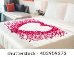 White pillow and Red rose flower on bed decoration in bedroom interior - Vintage Light Filter