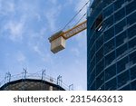 Small photo of Construction site, crane working, crane counterbalance.