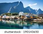 Typical Norwegian fishing village with traditional red rorbu huts, Reine, Lofoten Islands, Norway