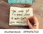 Retro effect and toned image of a woman hand writing on a notebook. Handwritten quote You never get a second chance to make a good first impression as inspirational concept image