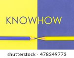 Small photo of KnowHow concept with Yellow and Violet coloured pencils and paper.