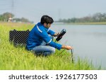 Small photo of A technician use the Professional Water Testing equipment to measure the water quality at the public canal ,Portable multi parameter water quality measurement ,water quality monitoring concept