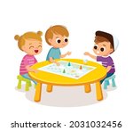 cheerful children seat by table ... | Shutterstock .eps vector #2031032456