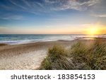Sunset Over Sand Dunes At...