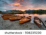 Sunset Over Wooden Boats On The ...