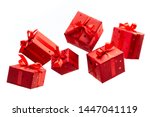 Surprise in flying boxes wrapped in red gift paper with bow on white background. Concept of holidays and greeting cards. Copy space.	