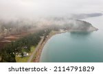 Small photo of West Side Lummi Island, Washington. Fog envelops Legoe Bay and the coastline of Lummi island and Lover's Bluff.