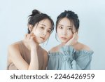 Beauty concept of two Asian women in transparent color tone. skin care.
