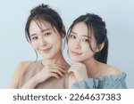 Small photo of Beauty concept of two Asian women in transparent color tone. skin care.