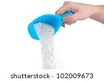 blue container with Washing powder in hand,isolated on white