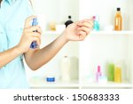 woman testing perfume on shop... | Shutterstock . vector #150683333