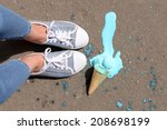 Ice cream fell on asphalt top view