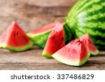 Fresh sliced watermelon wooden background