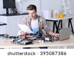 Young Man Repairing Computer...