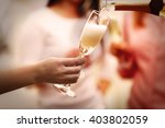 Pouring Champagne Into Glass At ...