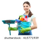 Young woman holding cleaning tools and products in bucket, isolated on white