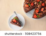 Delicious chocolate cake with strawberry on plate