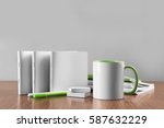 Blank goods on wooden table and grey background
