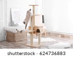 Cute Kitty On Cat Tree At Home