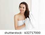 Beautiful young woman after shower at home