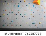 Grey Wall With Climbing Holds...