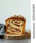 Small photo of Sweet marbled brioche plait with nuts and chocolate