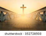 silhouette christian cross at railhead wooden bridge and orange sky with lighting,religion concept