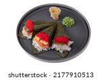 Small photo of Spring roll with tobiko caviar, scrambled eggs, rice, shrimp, tuna, salmon, philadelphia cheese, nori, wasabi, ginger on a platter on a white plate