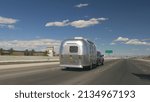 Small photo of Las Vegas, Nevada, USA - June 13, 2010: image of an Airstream Travel Trailer pulled by a truck shown driving on Interstate 15.