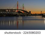 Small photo of Long Beach, California, United States - February 20, 2023: illuminated Gerald Desmond Bridge show at dusk at the Port of Long Beach.