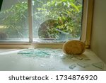A rock thrown through a window