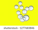 Small photo of Light air bubbles isolated over a yellow background.