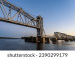 Sailing on Mississippi river under Wabash Railroad bridge near Hannibal, Missouri with Illinois on the other bank