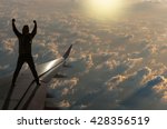 silhouette of man who show hands over the sun with clouds on airplane wing, Challenge business concept