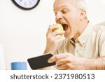 Small photo of The focus is on a green apple. As the elderly prankster enjoys every drop of its vitamins in his kitchen, he recalls the proverb and his commitment to quality fruit