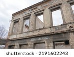 Historic old Early 20th century brick ruined derelict abandoned house villa building facade