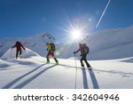 ski group starts in the morning sun