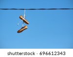 Pair Of Old Shoes Hang On Power ...