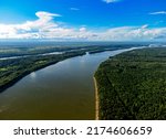 Small photo of Vasyugan swamp from aerial view. Ob river top view. Pine forest on the river shore. The biggest mire in the world. Taiga forest. Siberia, Russia