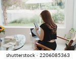 Asian working woman hold mobile phone text message, chat conversation or using social media. Businesswoman use smartphone browse web, read e-book, trade stocks. Communication technology concept.