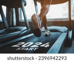 Small photo of Happy new year 2024,2024 symbolizes the start of the new year. Close up of feet, sportsman runner running on treadmill in fitness club. Cardio workout. Healthy lifestyle, guy training in gym.