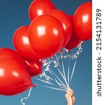 Small photo of Closeup Photo of Many Red Balloons over Blue Sky Background. Happy Birthday Attribute. Festive Background.