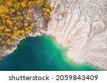 Small photo of Amazing kaoline quarry, texture of kaolin quarry, abstract patern of kaolin and beautiful water, aerial view of industrial clay hills, environment after mining