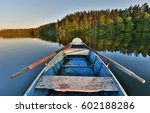 Fishing Boat In A Calm Lake...